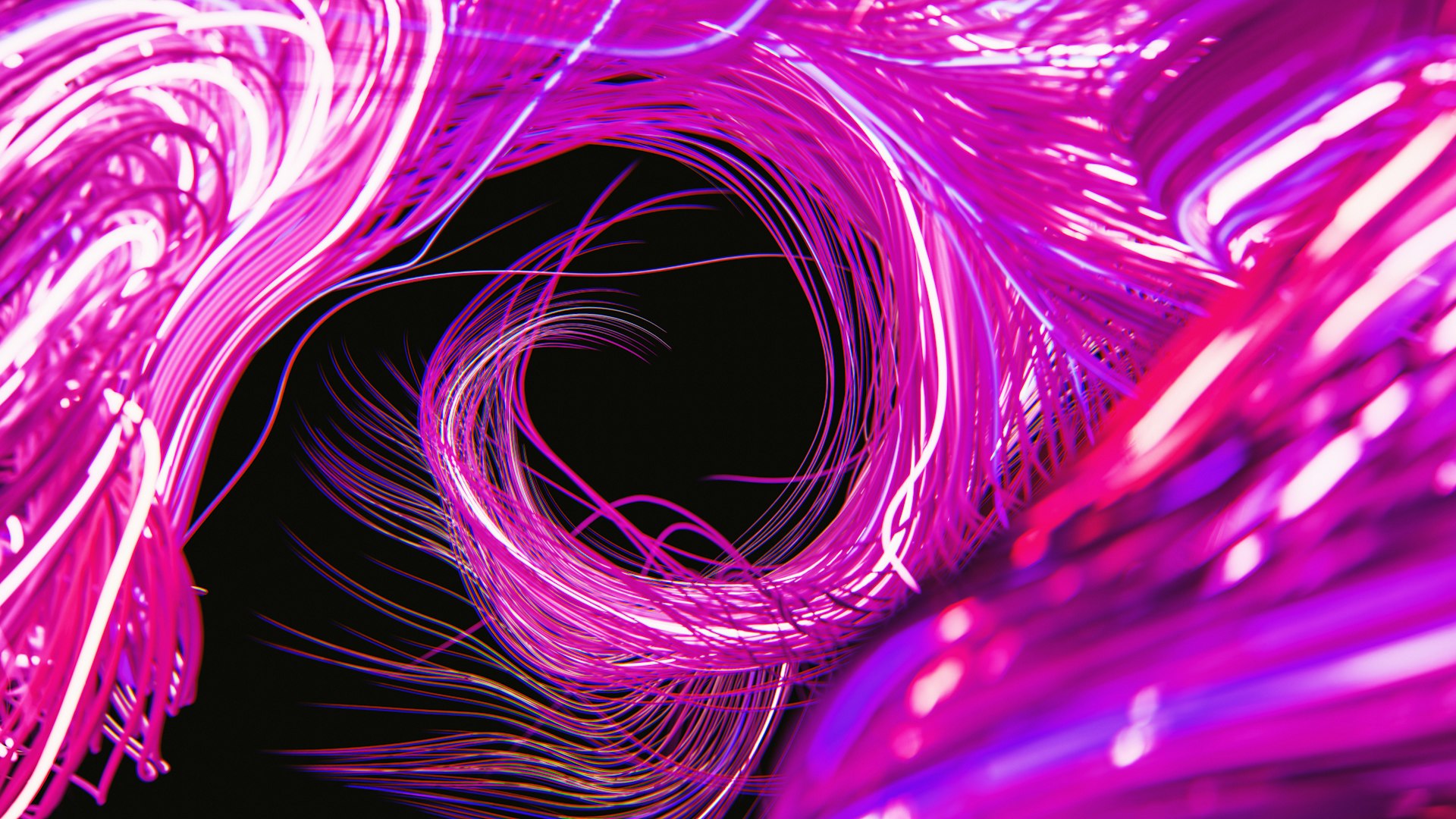 Abstract swirls of magenta light shine brightly.